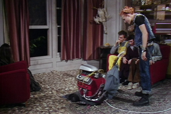 Look, bottom left... the mystery girl